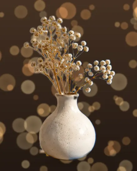 The vase photo with warm lights behind it